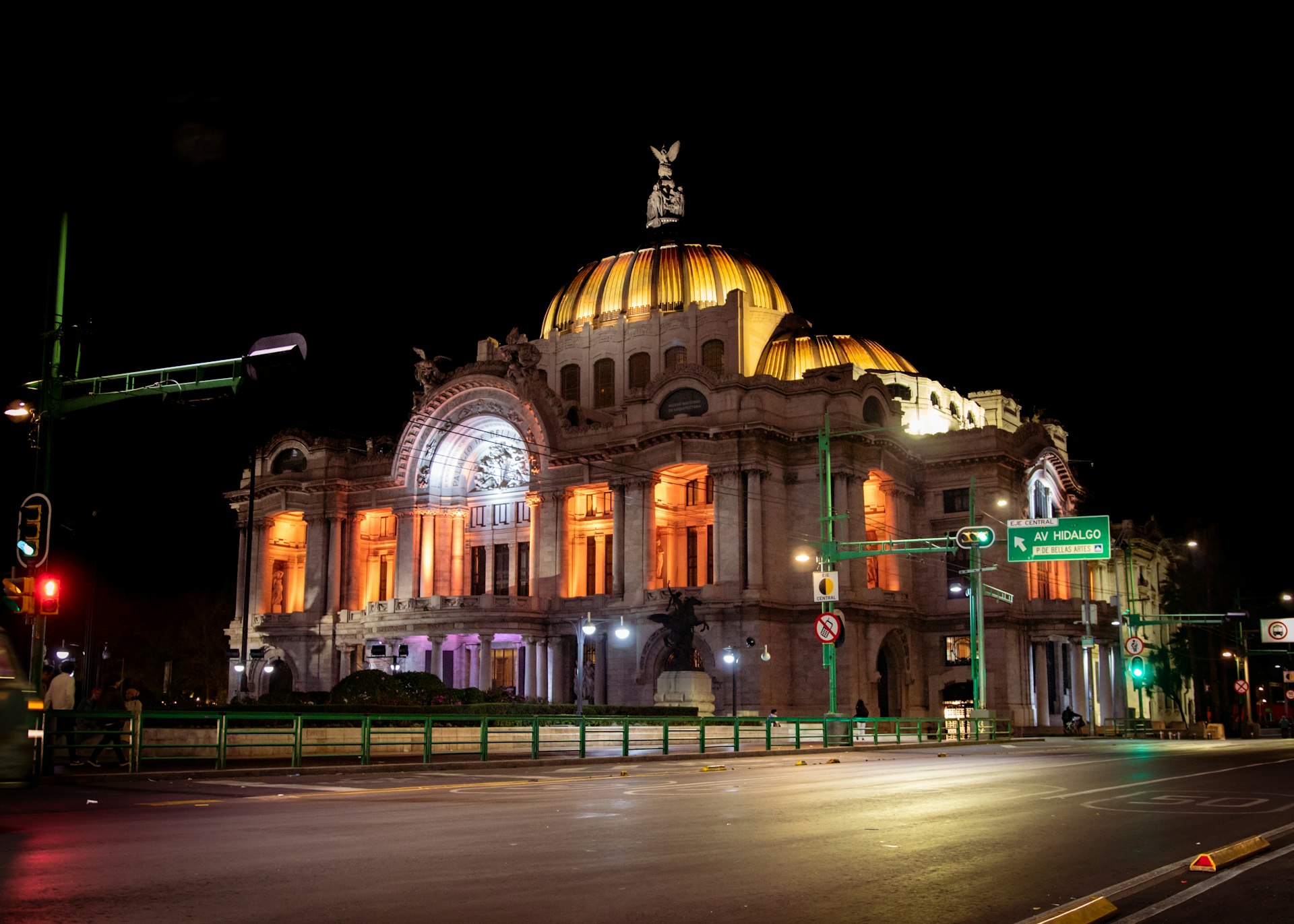 a large building with a gold domed roof at night